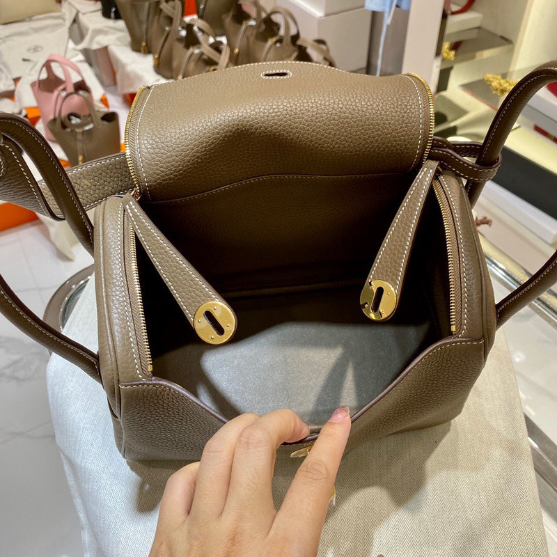 Side view of streamlined structured handbag