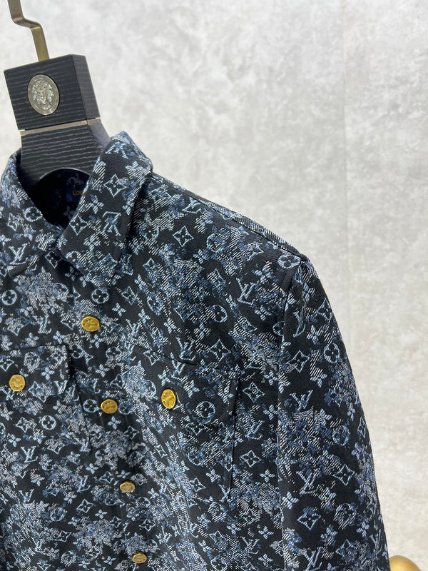 Flat lay presentation of Louis Vuitton luxury clothing with label-forward styling