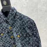 Flat lay presentation of Louis Vuitton luxury clothing with label-forward styling