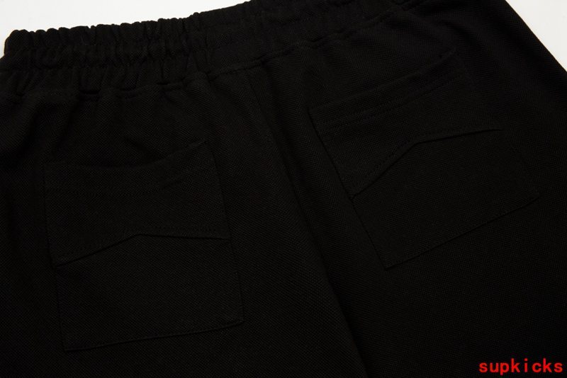 Close-up detail shot of Rhude luxury clothing with contemporary cut