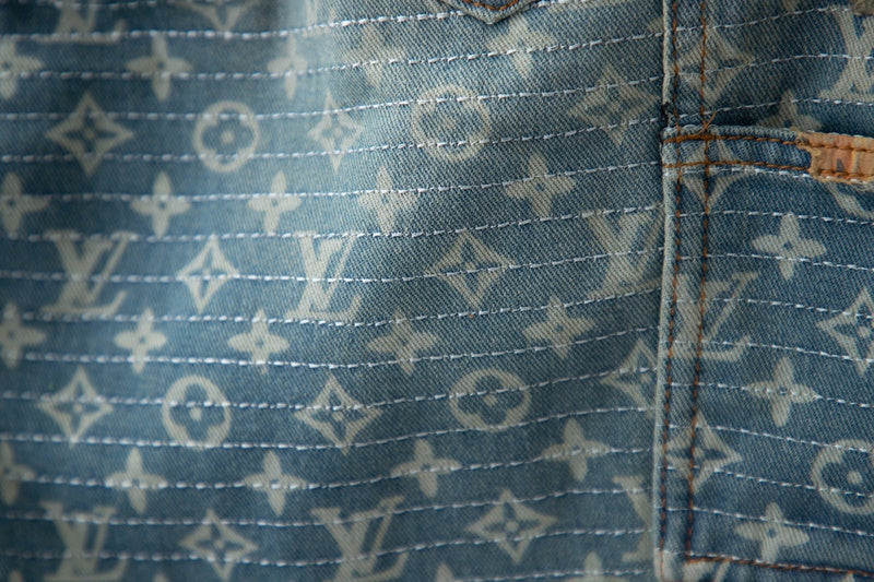 Flat lay presentation of Louis Vuitton luxury clothing with logo-detail design