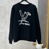 Back view of Louis Vuitton luxury clothing with label-forward styling