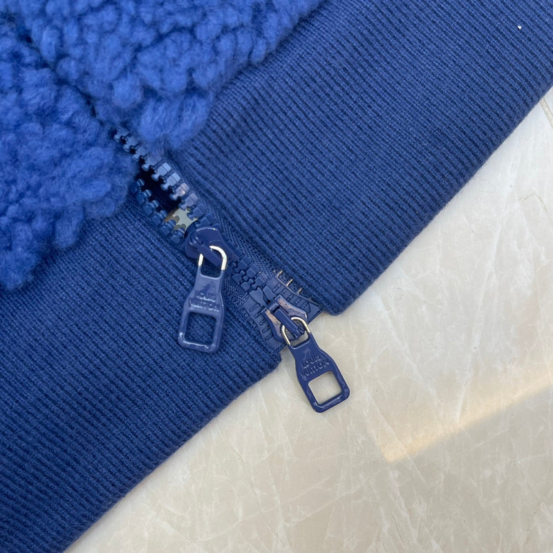 Flat lay presentation of Louis Vuitton luxury clothing with everyday silhouette