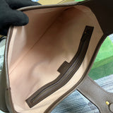 Side view of sleek structured handbag