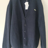 Side profile of Lacoste luxury clothing with monogram-inspired silhouette