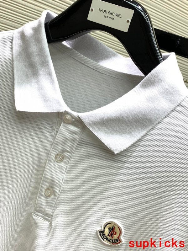 Close-up detail shot of Moncler luxury clothing with signature branding