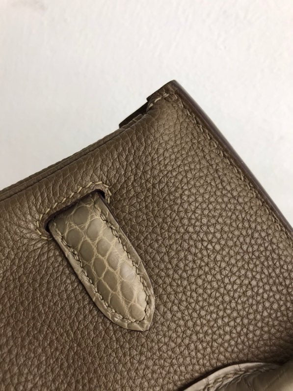  Elegant structured bag carried on shoulder