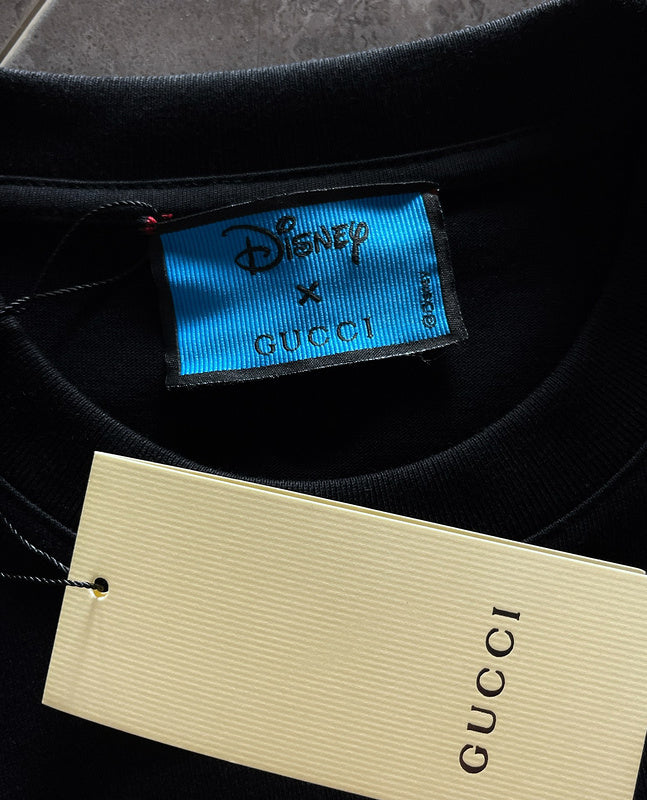Flat lay presentation of Gucci luxury clothing with monogram-inspired silhouette