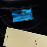 Flat lay presentation of Gucci luxury clothing with monogram-inspired silhouette