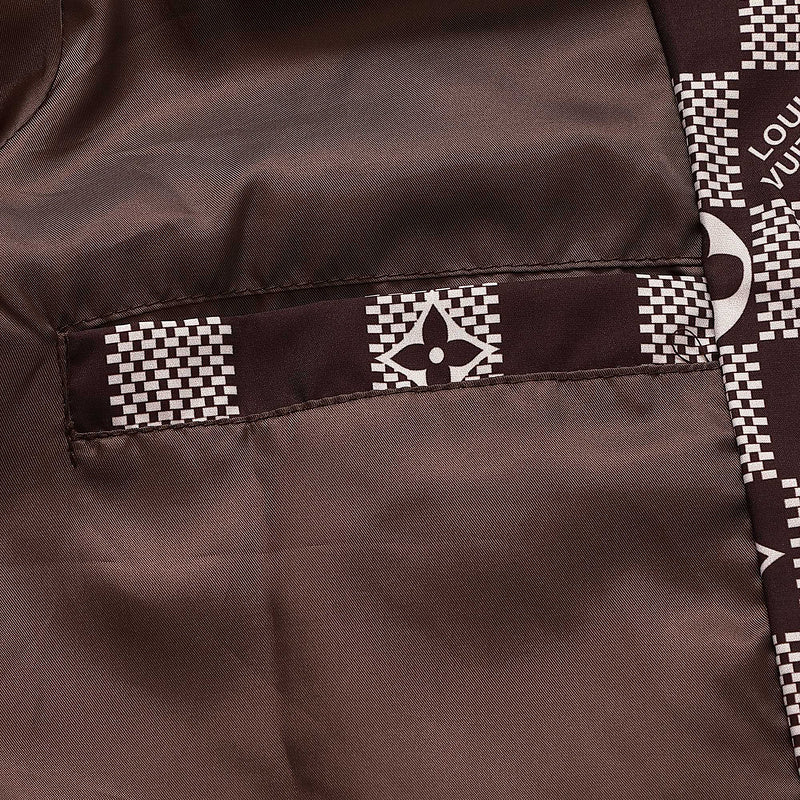 Close-up detail shot of Louis Vuitton luxury clothing with logo-detail design