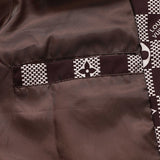 Close-up detail shot of Louis Vuitton luxury clothing with logo-detail design