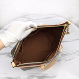 Handle and strap detail of classic everyday-luxe women's handbag – women's designer-style accessory