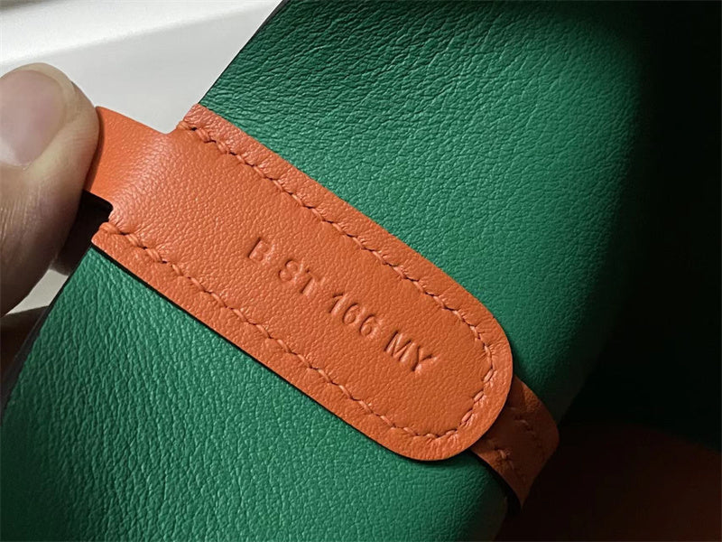  Streamlined top-handle bag carried on shoulder
