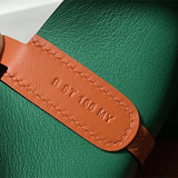  Streamlined top-handle bag carried on shoulder