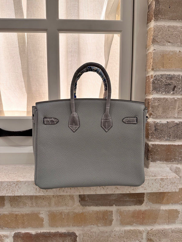 Side view of sleek structured handbag