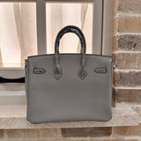 Side view of sleek structured handbag