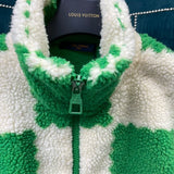 Close-up detail shot of Louis Vuitton luxury clothing with signature branding