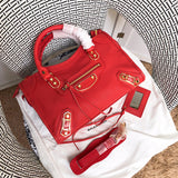 Front view of statement polished women's handbag – women's designer-style accessory