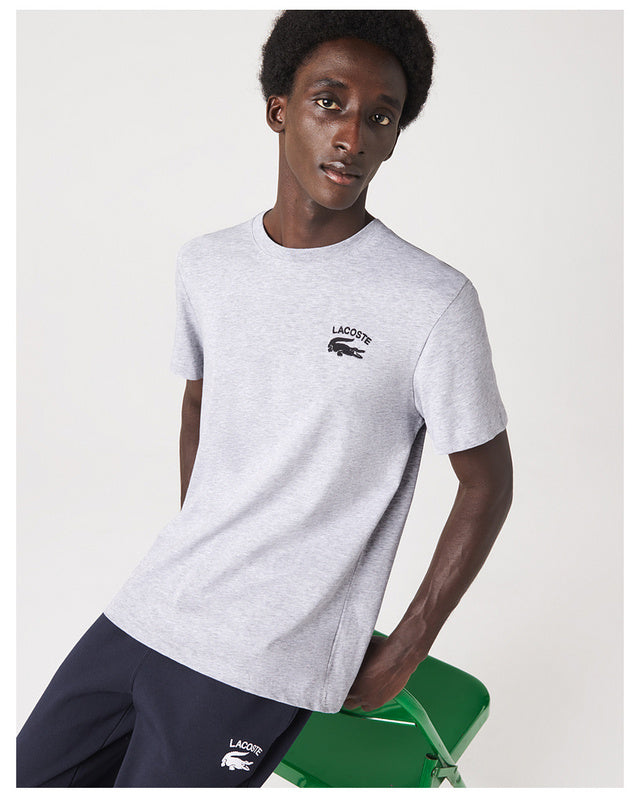 Side profile of Lacoste luxury clothing with signature branding