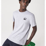 Side profile of Lacoste luxury clothing with signature branding