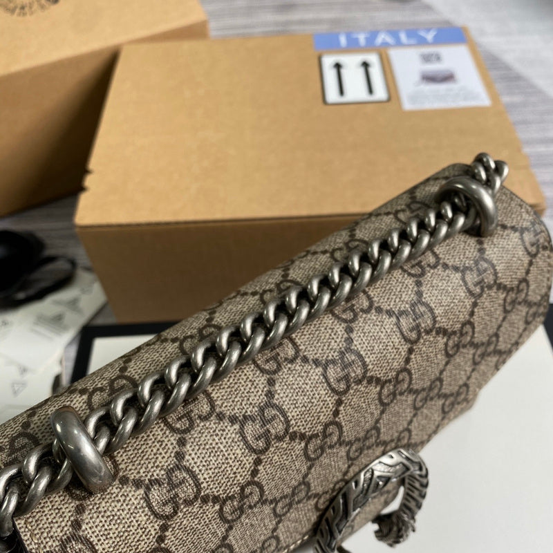 Styled lifestyle shot of signature polished women's handbag – women's statement bag