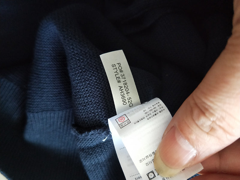 Front view of Lacoste luxury clothing with monogram-inspired silhouette