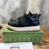 Side profile of Gucci tonal black sneakers padded collar comfort