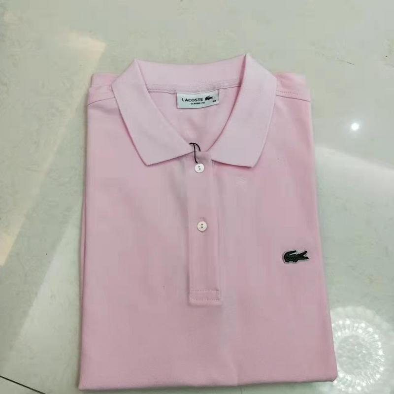 Side profile of Lacoste luxury clothing with signature branding