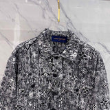 Close-up detail shot of Louis Vuitton luxury clothing with label-forward styling