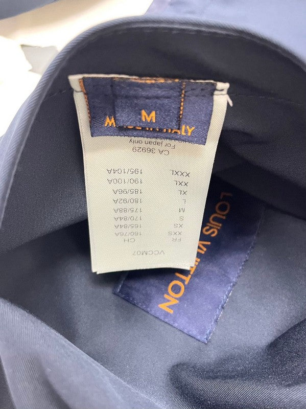Side profile of Louis Vuitton luxury clothing with tailored silhouette