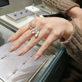 Lifestyle view of Van Cleef & Arpels unisex jewelry piece