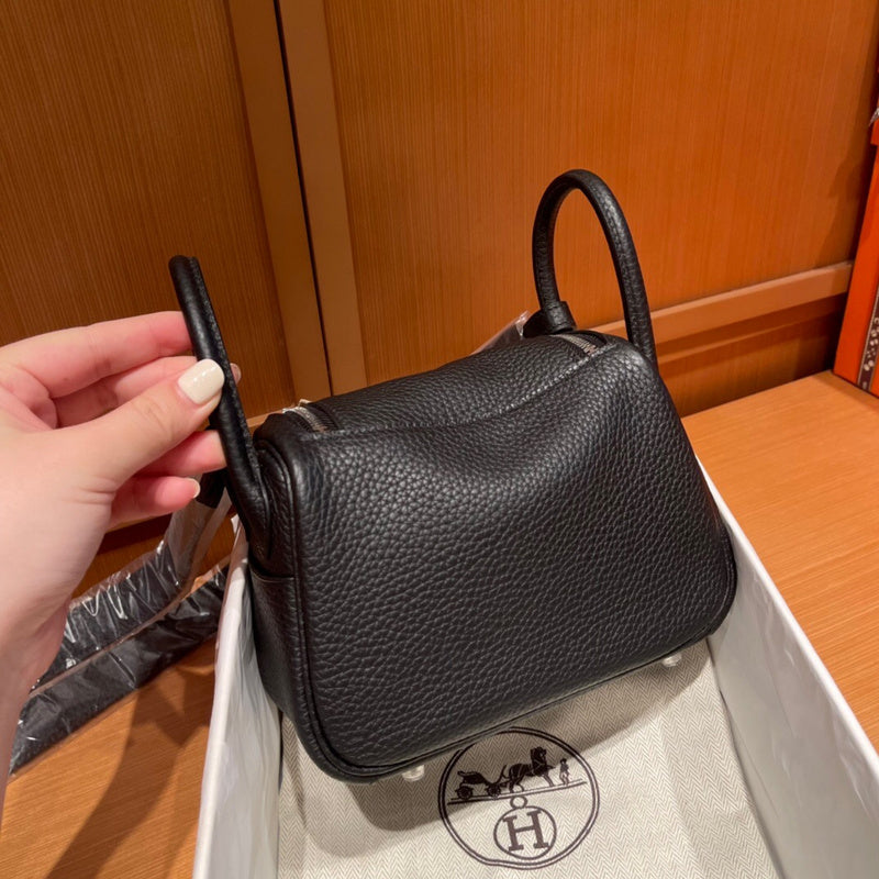Side view of poised structured handbag