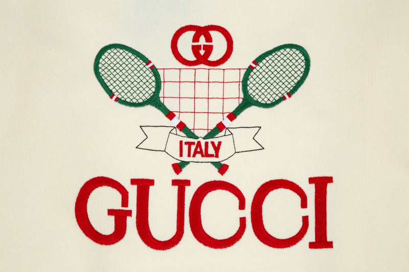 Flat lay presentation of Gucci luxury clothing with contemporary cut