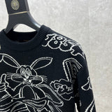 Full styled look of Louis Vuitton luxury clothing with label-forward styling