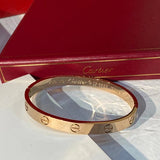 Side view of Cartier unisex jewelry piece