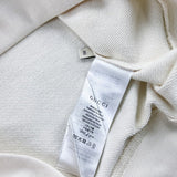Close-up detail shot of Gucci luxury clothing with signature branding
