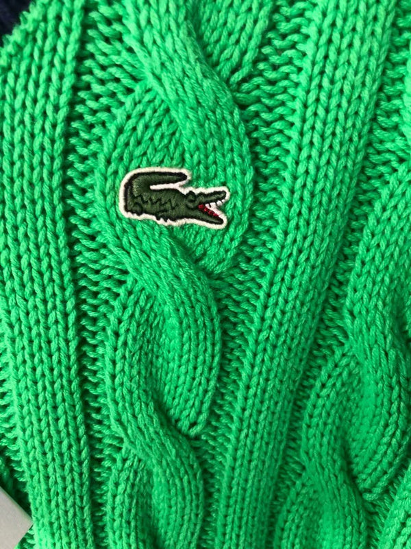 Side profile of Lacoste luxury clothing with monogram-inspired silhouette