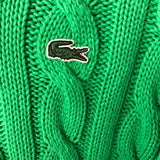 Side profile of Lacoste luxury clothing with monogram-inspired silhouette