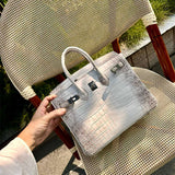  contemporary top-handle bag detail view showing craftsmanship 14