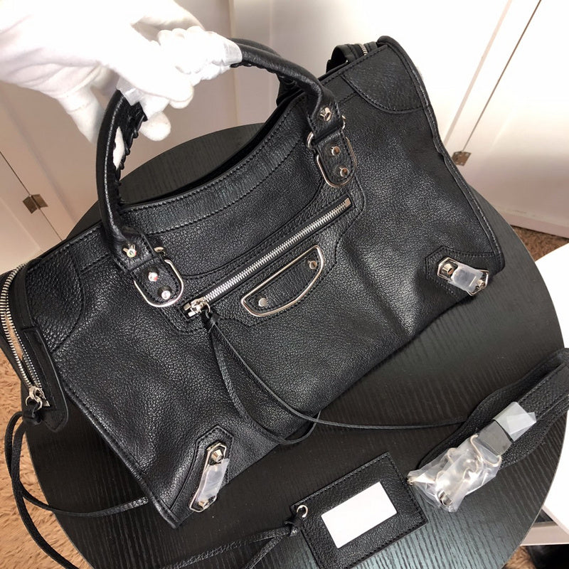 Styled lifestyle shot of modern refined women's handbag – women's luxury handbag