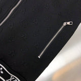 Flat lay presentation of Louis Vuitton luxury clothing with signature branding