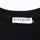 Close-up detail shot of Givenchy luxury clothing with monogram-inspired silhouette