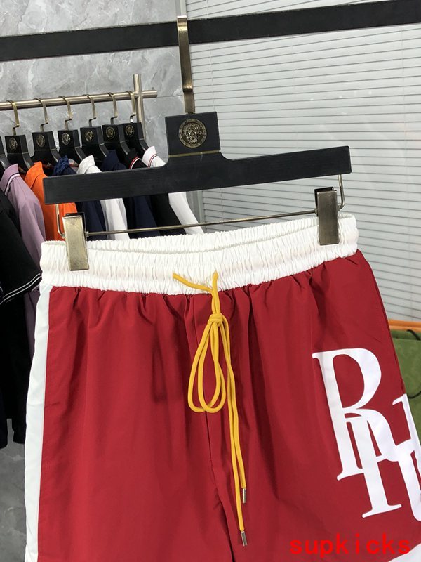 Close-up detail shot of Rhude luxury clothing with label-forward styling