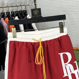 Close-up detail shot of Rhude luxury clothing with label-forward styling