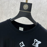 Close-up detail shot of Louis Vuitton luxury clothing with logo-detail design