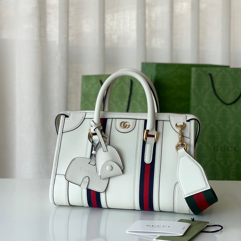 Handle and strap detail of statement polished women's handbag – women's everyday handbag