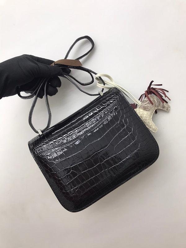 Side view of poised structured handbag