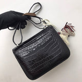 Side view of poised structured handbag