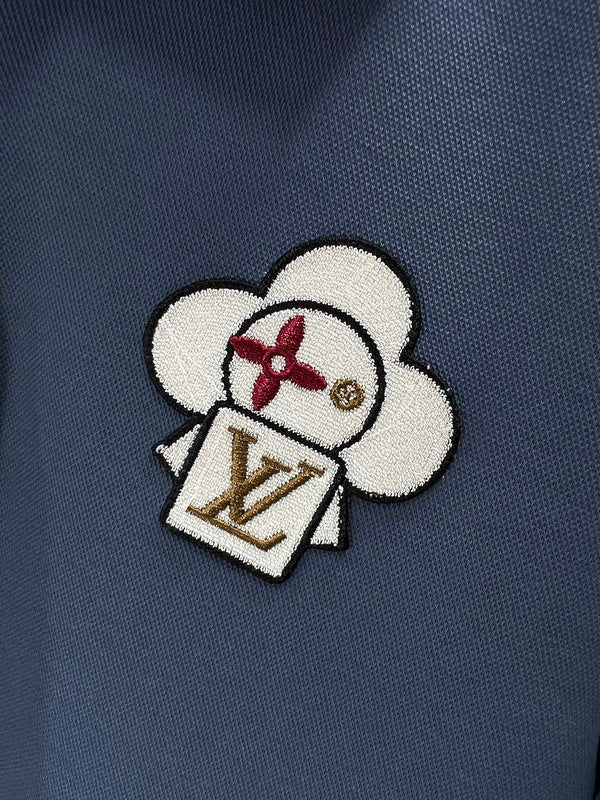 Flat lay presentation of Louis Vuitton luxury clothing with logo-detail design