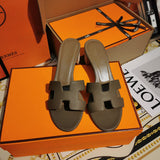 Hermès Tan Flat Thong Sandals - Angled View